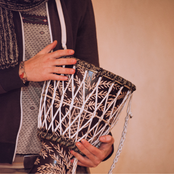 Man playing a drum.