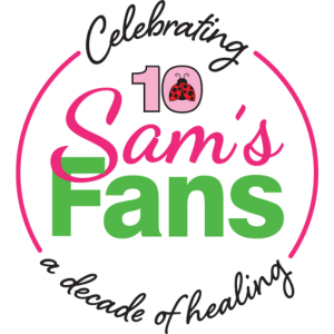 This logo represents "Sam's Fans," an organization celebrating its 10-year milestone. The circular design features vibrant colors with the text "Sam's Fans - Celebrating A Decade of Healing." A red and black ladybug sits above the number "10."
